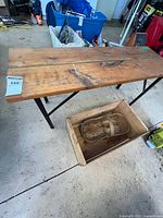 Top view of folding wooden table with crate and basket
