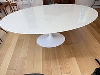 Top view of white oval quartz table on tulip base