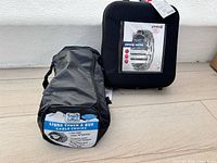 Both snow chain sets, pewag in hard case, Laclede in zip bag