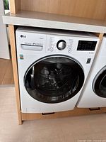 Front view of LG washer in cabinet opening