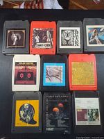 Front view showing nine of the ten 8-tracks with album artwork
