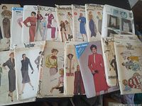 Front view of multiple pattern envelopes showing brand names and garment illustrations