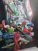 Bag of assorted embroidery floss skeins in many colours