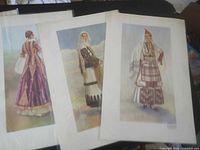 Three art prints depicting female folk costumes in sleeves
