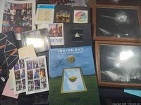 Lot overview with signed book, tie, stamps, 8-tracks, Video CDs and framed photos visible