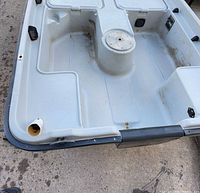 Interior view of jon boat with molded compartments and pedestal mounts