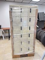 Front view of beige metal locker cabinet with 15 doors and Hallowell branding, shrink-wrapped