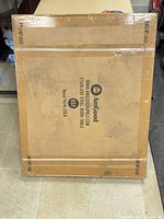 Sealed brown carton showing AmGood branding and model information