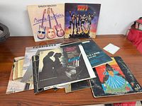 Front view showing KISS, Savoy Brown and stack of other LPs