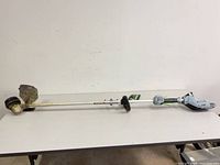 Full view of EGO cordless string trimmer on table