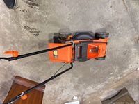 Top view of LawnMaster mower showing 20-in deck, handle, and motor cover