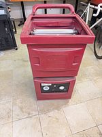 Full view of red Novair 1000 air scrubber showing overall condition