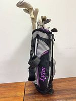 Side view of Lynx stand bag loaded with clubs