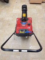 Top view showing Toro branding, control panel, chute and handle