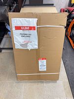 Factory-sealed Uline shipping carton with packing list attached
