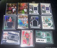 Overview of all 11 rookie patch cards in protective holders