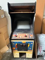 Front view of arcade cabinet showing monitor, control panel, coin door and artwork