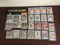 Overall view of magazine and 23 sleeved trading cards on table
