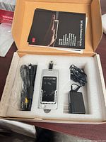 Projector, power supply, AV cable, manual in foam packaging