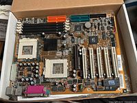 Top view of ABIT VP6 motherboard showing sockets, slots and connectors
