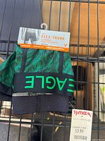 Front view showing waistband, pattern, and retail packaging