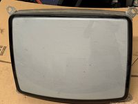 Front view of 19-inch CRT screen with bezel and mounting tabs visible
