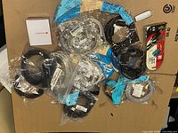 Overall view of assorted sealed cables and adapters on cardboard background