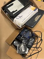 Overall contents: adapters, cables, stethoscope box, clipboard, electronic component