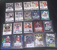 All 20 cards laid out in four rows of five showing fronts, signatures, patches and parallels