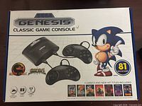 Front of sealed Sega Genesis Classic Game Console retail box showing console, controllers, Sonic graphic, 81 built-in games badge.