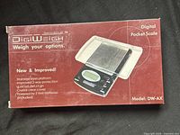 Retail box showing DigiWeigh DW-AX digital pocket scale image and specifications