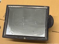 Front view of Elo 15-inch touchscreen monitor with scratched screen