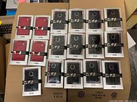 All 17 Evouni pouches in packaging, red and black variants