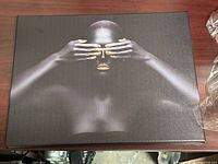 Front view of canvas art showing female figure with gold accents