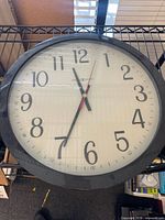 Front view showing face, numerals, hands, frame
