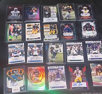 Front view of first ten autographed rookie cards in sleeves