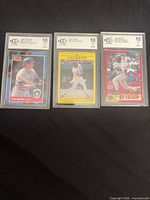 Front view of all three BCCG graded cards
