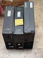 Front view of three SFF desktops (OptiPlex 760, OptiPlex 755, ThinkCentre) side-by-side