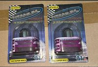 Two blister-packaged Titanium 7440 bulbs showing front artwork and branding