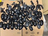 All 50 mice spread on boxes showing quantity, cables, mixed brands
