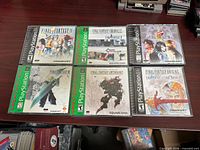 Six PS1 Final Fantasy game cases laid out in two rows