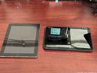 Front view of both tablets on desk