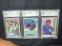 Front view of all three BCCG-graded cards in slabs