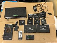 Overall lot showing WyreStorm hub, Binary modules, Calrad amplifier, remote, power adapters