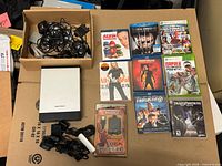 Group shot showing all media cases, GearHead drive, cables, battery pack