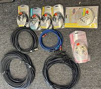All ten cables laid out: six packaged, four loose