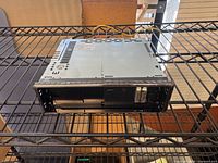 Front and top view of Panasonic CQ-C7401U head unit on shelf