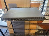 Front view showing full width, buttons 1-16, Pelco branding