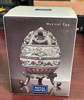 Front of retail box showing musical egg image and branding