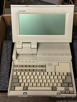 Front view showing screen and keyboard